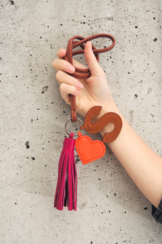 Petit Mai Leder‑Tassel‑Schlüsselanhänger Aufgeweckt