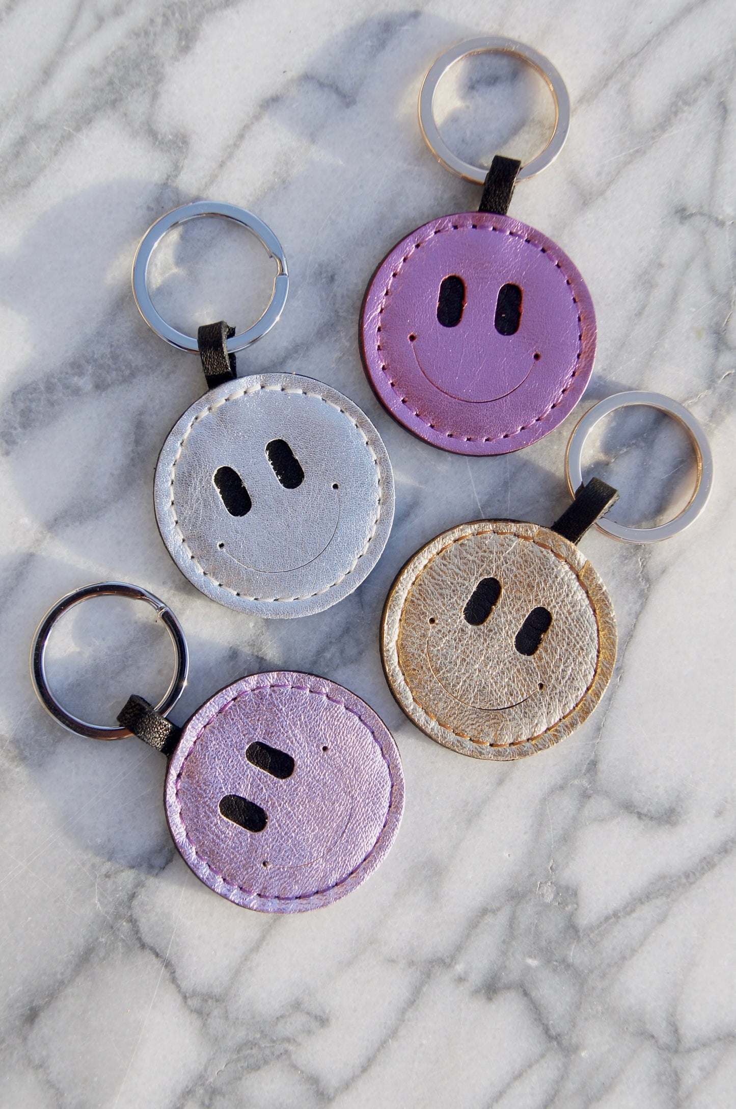 Petit Mai Smiley Schlüsselanhänger Aufgeweckt