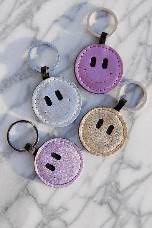 Petit Mai Smiley Schlüsselanhänger Aufgeweckt