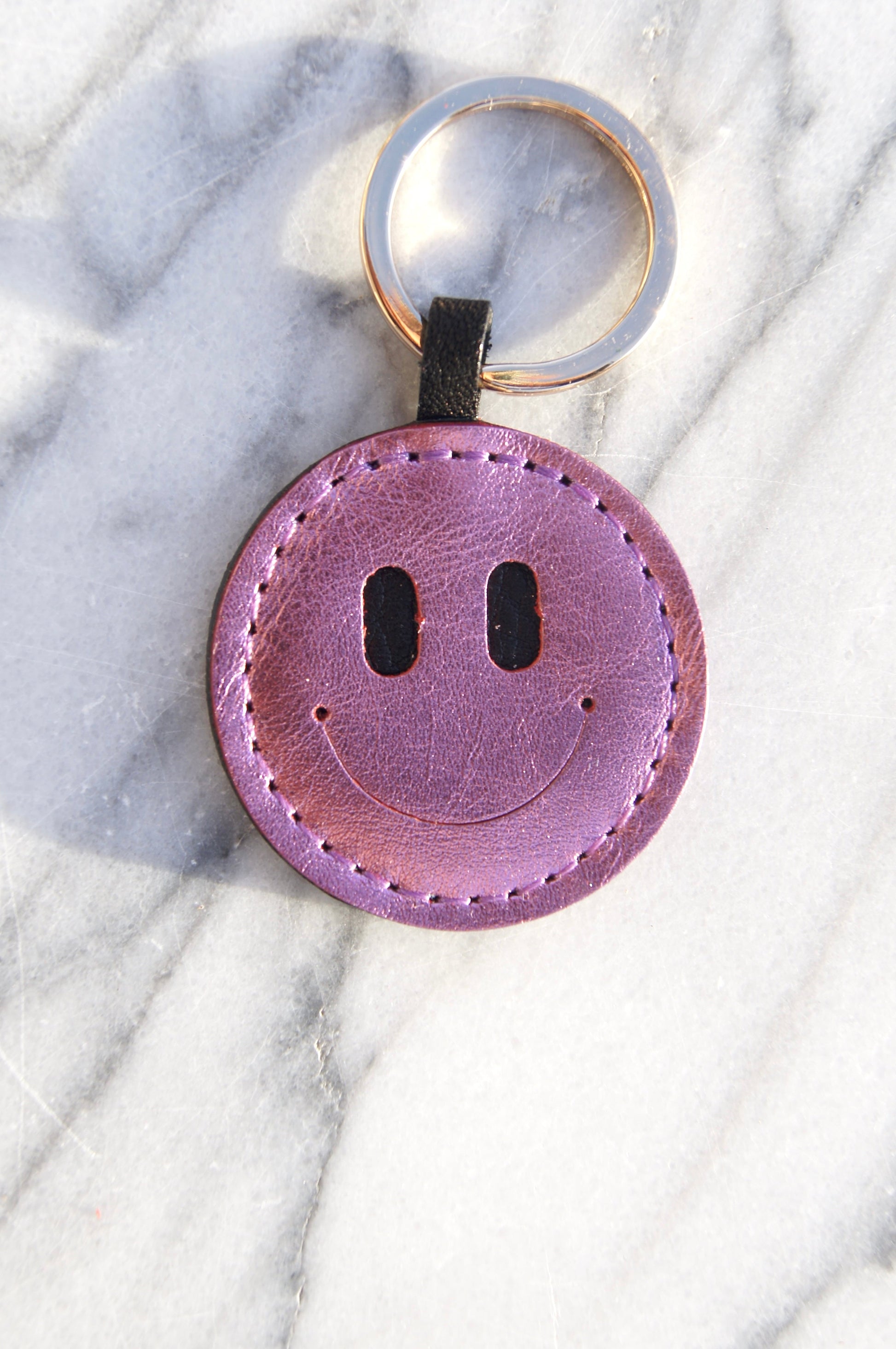 Petit Mai Smiley Schlüsselanhänger Aufgeweckt