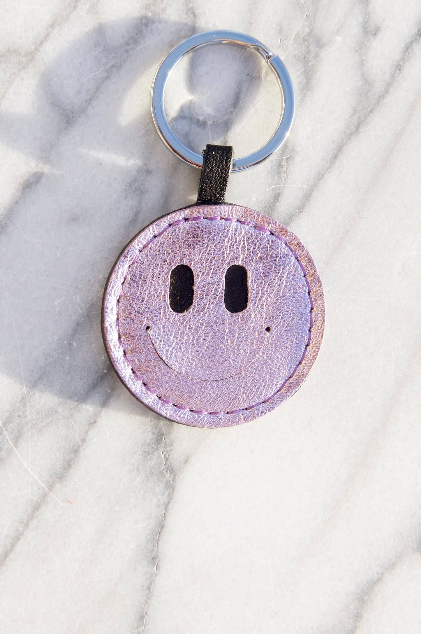 Petit Mai Smiley Schlüsselanhänger Aufgeweckt