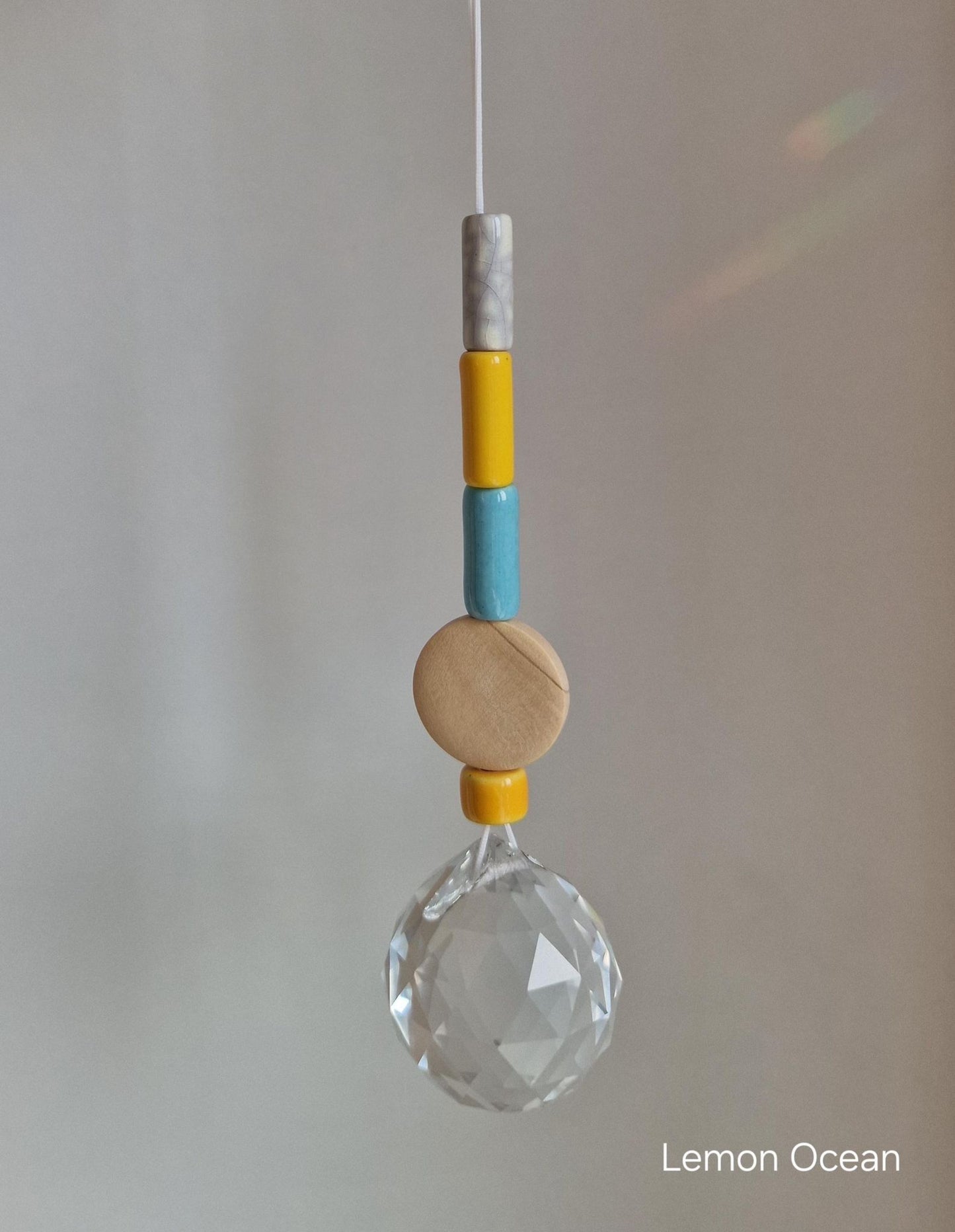 Orvokki Suncatcher | verschiedene Farben Aufgeweckt