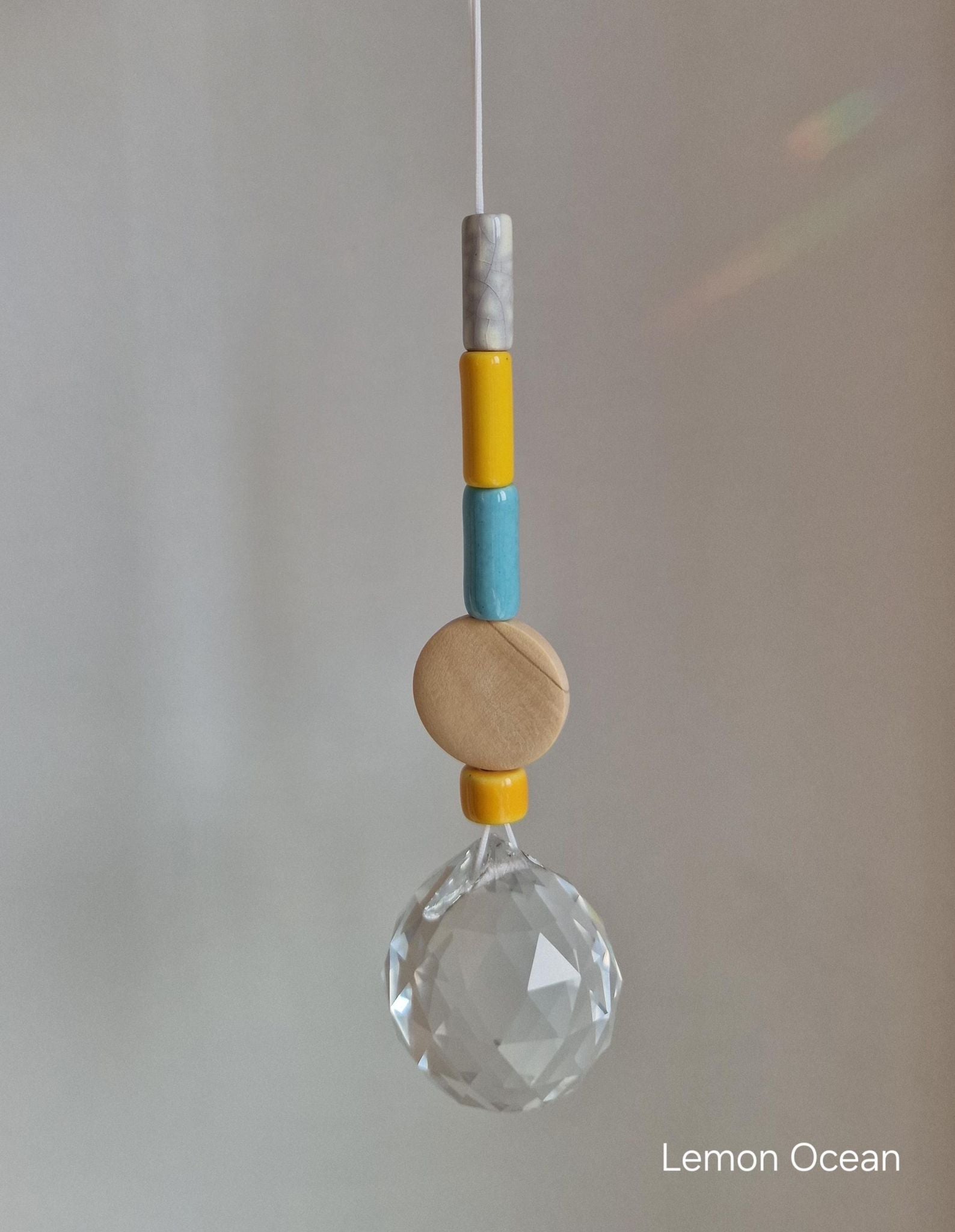 Orvokki Suncatcher | verschiedene Farben Aufgeweckt